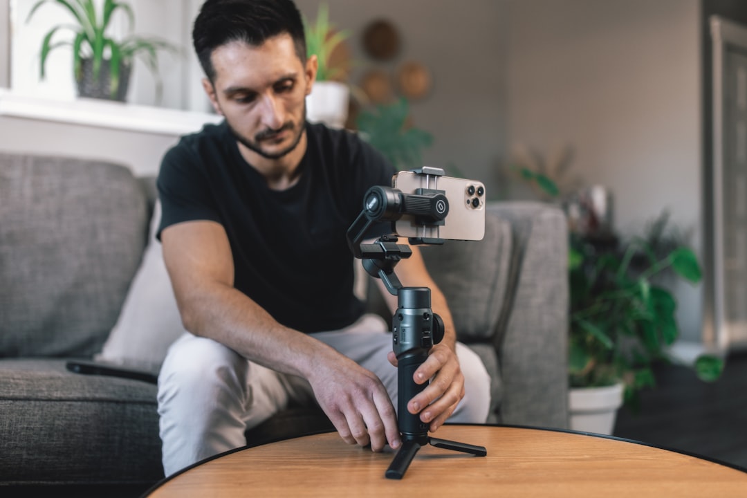 Young creator filming video with smartphone